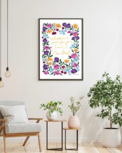 Poster med ett tänkvärt citat som omges av färgglada blomster